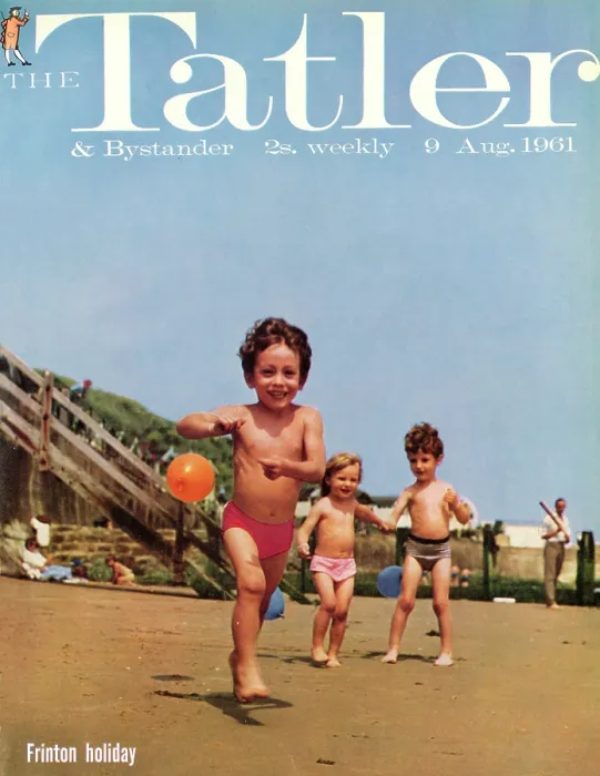 Framed Print : Tatler Front Cover - Three small children, two boys and a girl, are playing on the beach at Frinton-on-Sea, holding blue and orange balloons on strings Framed Print : Tatler Front Cover - Three small children, two boys and a girl, are playing on the beach at Frinton-on-Sea, holding blue and orange balloons on strings