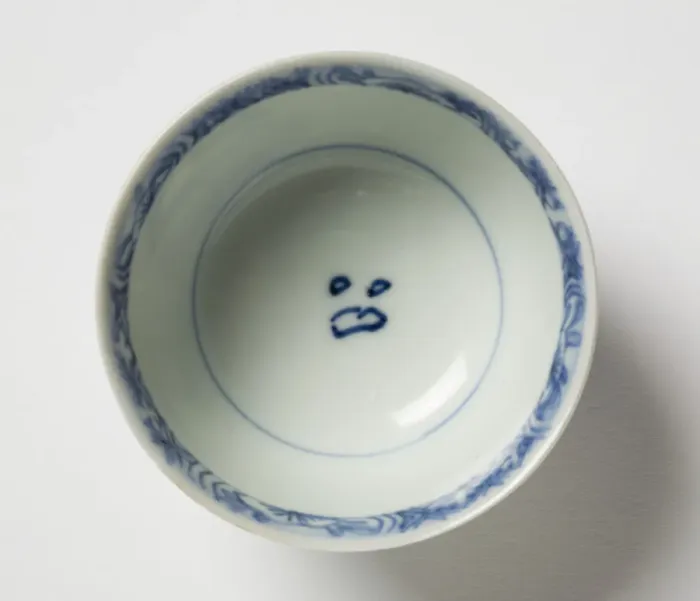 Framed Print : Tea bowl. Porcelain tea bowl with cobalt blue underglaze decoration of three figures Framed Print : Tea bowl. Porcelain tea bowl with cobalt blue underglaze decoration of three figures