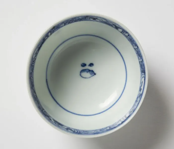 Framed Print : Tea bowl. Porcelain tea bowl with cobalt blue underglaze decoration of three figures Framed Print : Tea bowl. Porcelain tea bowl with cobalt blue underglaze decoration of three figures