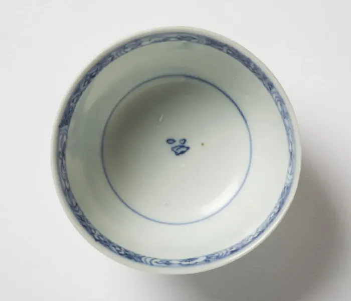Framed Print : Tea bowl. Porcelain tea bowl with cobalt blue underglaze decoration of three figures Framed Print : Tea bowl. Porcelain tea bowl with cobalt blue underglaze decoration of three figures