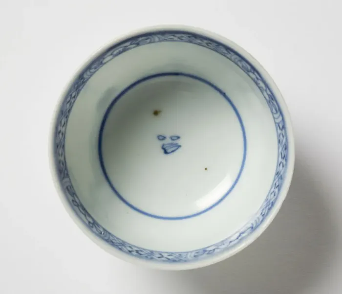 Framed Print : Tea bowl. Porcelain tea bowl with cobalt blue underglaze decoration of three figures Framed Print : Tea bowl. Porcelain tea bowl with cobalt blue underglaze decoration of three figures