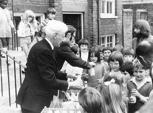 Teachers distributing milk to children, Woolwich, London