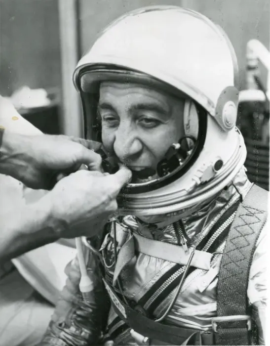 Framed Print : A technician adjusts the microphones for astronaut Virg? Framed Print : A technician adjusts the microphones for astronaut Virg?