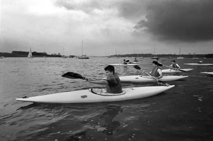 Framed Print : Teenagers paddle their canoes on Rutland Water, Leics Framed Print : Teenagers paddle their canoes on Rutland Water, Leics