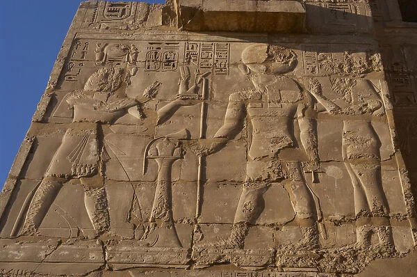 Temple of Ramses III. Relief depicting Ramses III making off