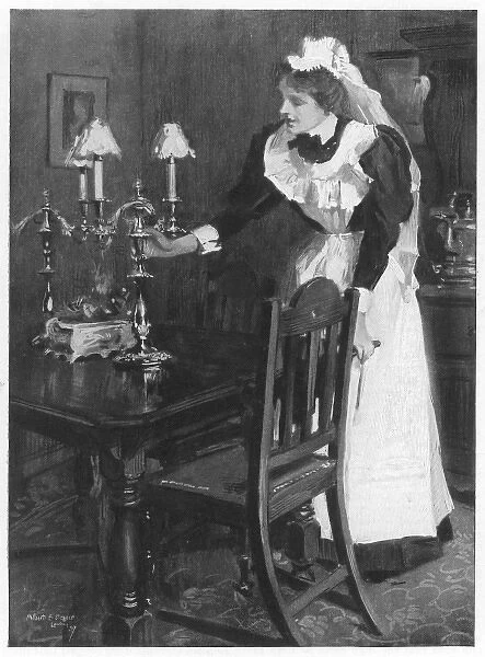 Tending the Lamps. A London housemaid tends the table-lamps