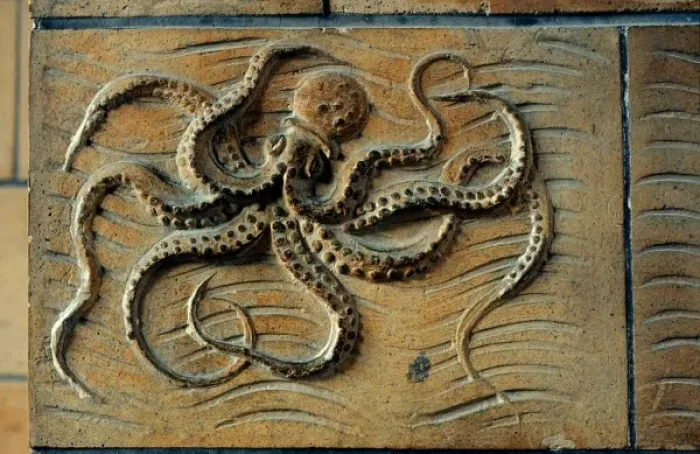 Framed Print : Detail of terracotta moulding of an octopus in the Waterhous