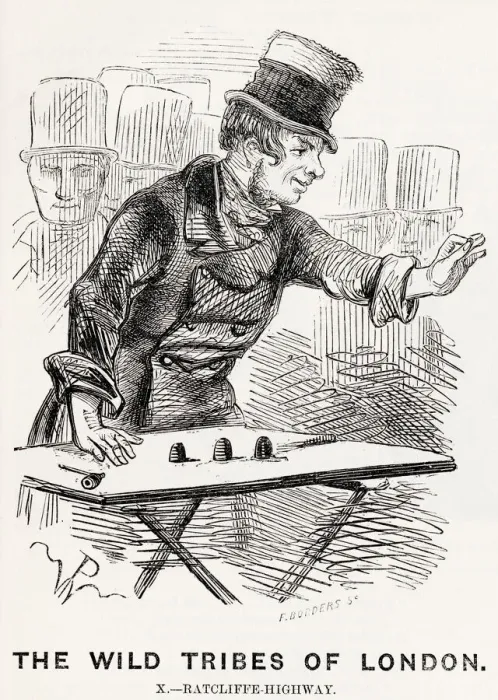 Framed Print : A thimble-rigger in a London street tries to trick members of the crowd with clever Framed Print : A thimble-rigger in a London street tries to trick members of the crowd with clever