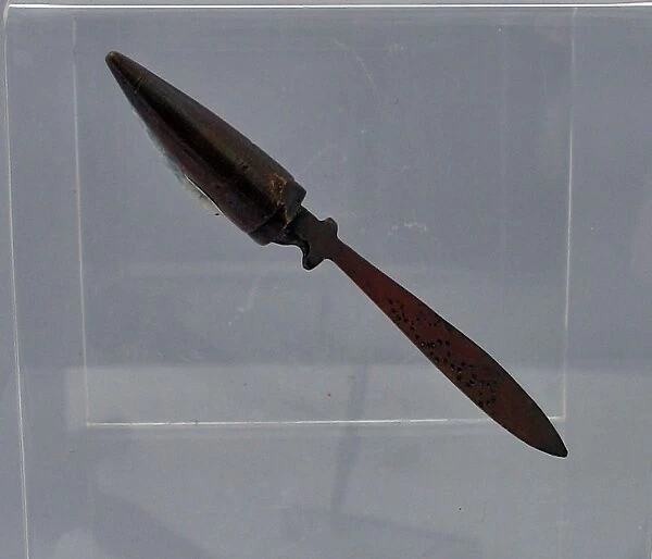 A tiny letter opener beaten from a copper bullet