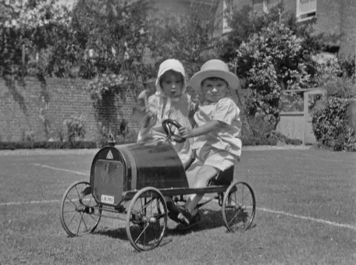 Framed Print : Two toddlers with toy car in a garden Framed Print : Two toddlers with toy car in a garden