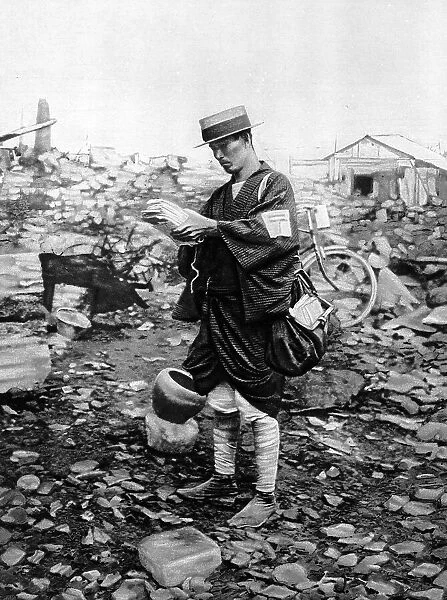 Tokyo postman delivering letters to the rubble
