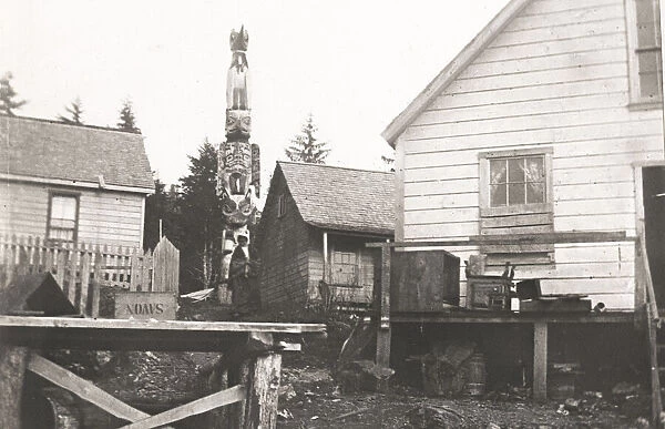 Totem pole and houses Ketchikan, Alaska