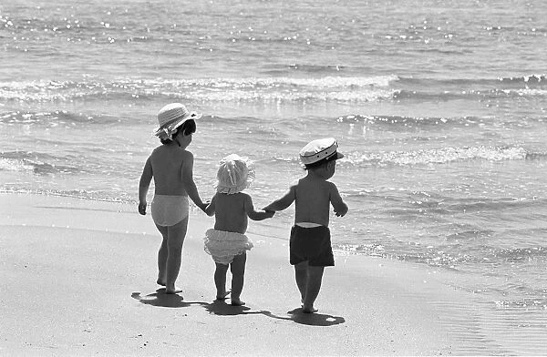 Three tots on beach, Tenby