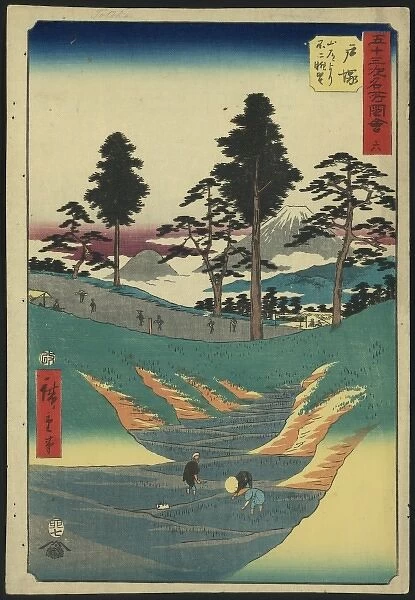 Totsuka. Print shows laborers in rice paddies in the foreground