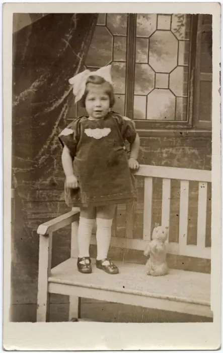 Framed Print : TOY CAT, a little girl with an enormous bow in her hair stands on a garden bench with her Framed Print : TOY CAT, a little girl with an enormous bow in her hair stands on a garden bench with her