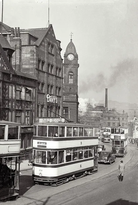 Framed Print : Trams and clocktower in Sheffield Haymarket. Can see Davy's food store Date: 1947 - 1948
