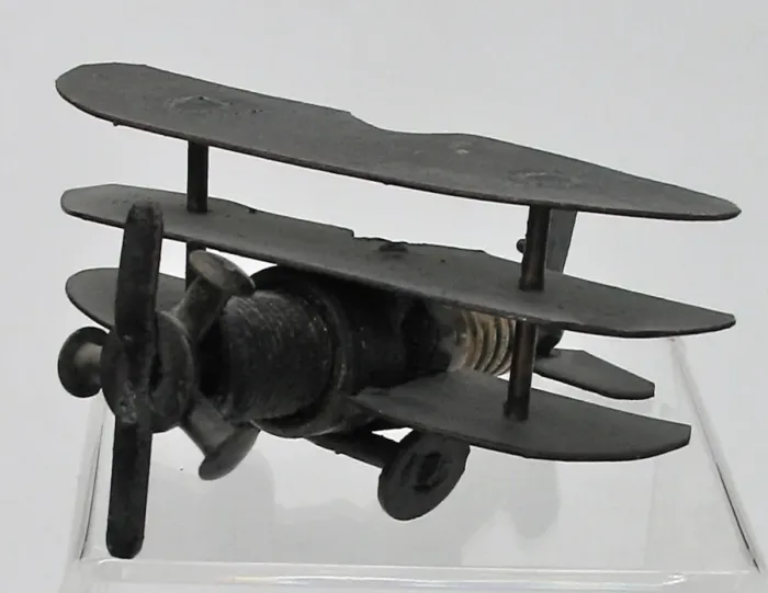 Framed Print : Trench Art triplane - a sparkplug fuselage and metal wings Framed Print : Trench Art triplane - a sparkplug fuselage and metal wings