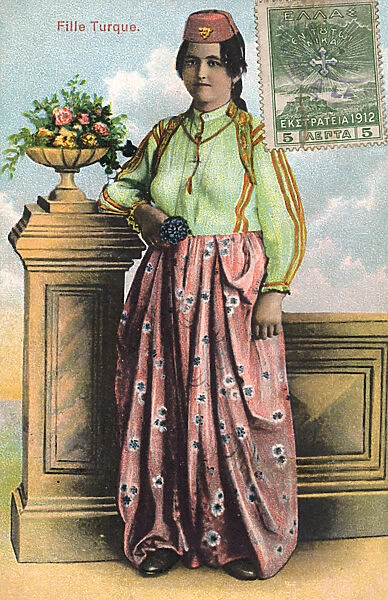 Turkish Woman in floral skirt and red fez hat