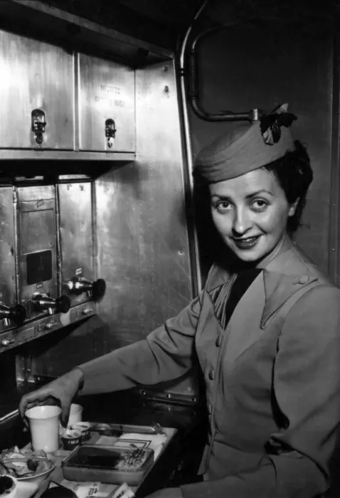 Framed Print : TWA air stewardess prepares a meal Framed Print : TWA air stewardess prepares a meal
