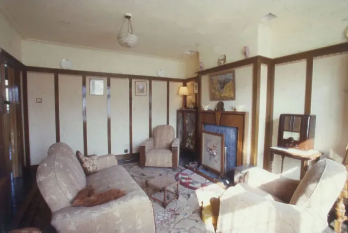 Framed Print : A typical living room or front reception room, with a picture rail, tapestry firescreen, Bakelite radio, display cabinet and three piece suit. Date: 1940s (re-enactment) Framed Print : A typical living room or front reception room, with a picture rail, tapestry firescreen, Bakelite radio, display cabinet and three piece suit. Date: 1940s (re-enactment)