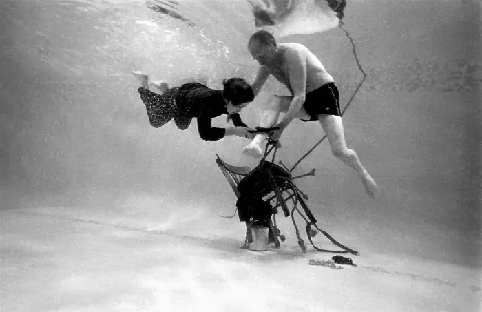 Framed Print : Underwater escapologist - a boy dives into a swimming pool to help a man untie himself from a chair. (2 of 3) Date: 1967 Framed Print : Underwater escapologist - a boy dives into a swimming pool to help a man untie himself from a chair. (2 of 3) Date: 1967