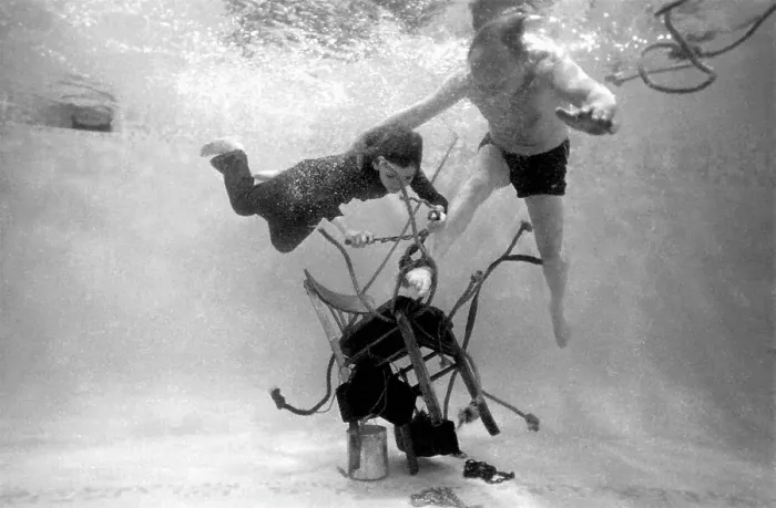 Framed Print : Underwater escapologist - a boy dives into a swimming pool to help a man untie himself from a chair. (3 of 3) Date: 1967 Framed Print : Underwater escapologist - a boy dives into a swimming pool to help a man untie himself from a chair. (3 of 3) Date: 1967