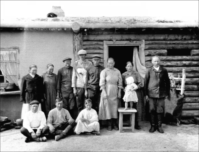 Framed Print : Unidentified group outside a hut Framed Print : Unidentified group outside a hut