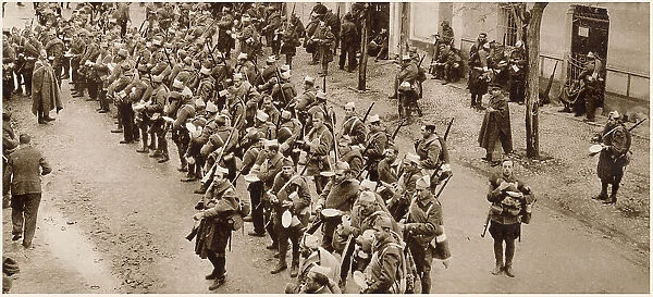 A unit of General Franco's Nationalist troops lined up to receive their rations, Alcorcon, near Madrid, 1936. At this point in the Spanish Civil War, these troops were involved in the attack on the Republican held capital, Madrid. Date: 1936