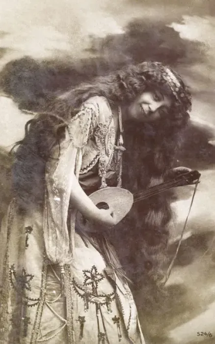 Framed Print : Unusual woman playing a small stringed instrument Framed Print : Unusual woman playing a small stringed instrument