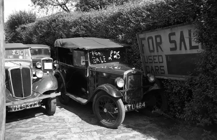Framed Print : Two used cars for sale including a Morris Eight (left) and an Austin seven AJ tourer (right). Date: circa 1950s Framed Print : Two used cars for sale including a Morris Eight (left) and an Austin seven AJ tourer (right). Date: circa 1950s