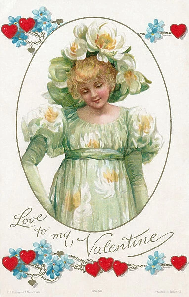 Valentine. Pretty young girl adorned in a pale green floral dress and hat