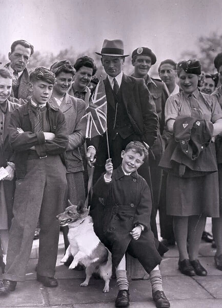 VE Day. A group of people celebrating VE Day including an excitable terrier