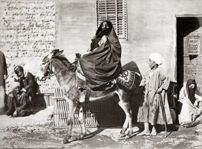 Framed Print : Veiled woman on a donkey, Egypt, circa 1880s Framed Print : Veiled woman on a donkey, Egypt, circa 1880s