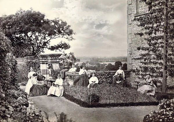 A Victorian family group seated in the garden