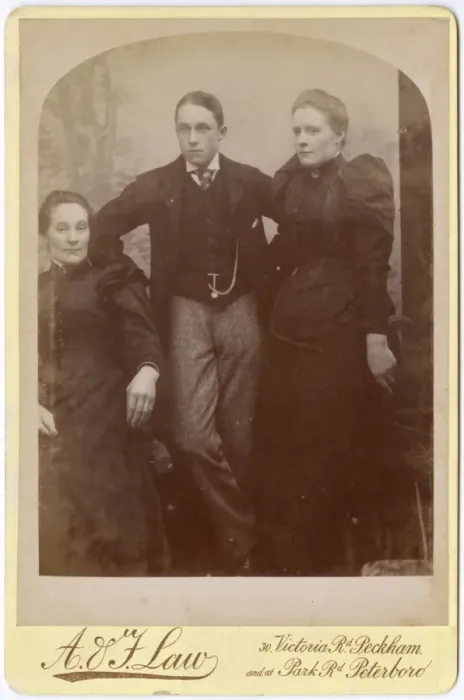 Framed Print : Two Victorian sisters and their brother in studio setting Framed Print : Two Victorian sisters and their brother in studio setting