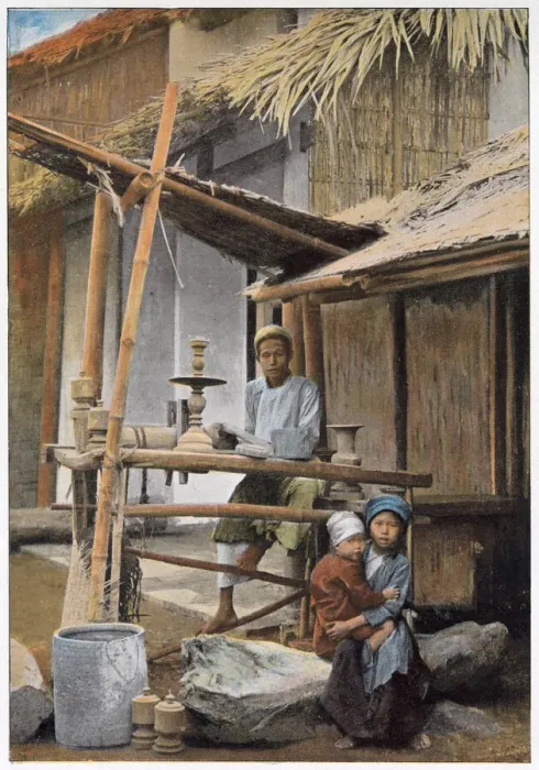 Framed Print : Vietnamese wood worker and his family outside their home. Date: 1890s Framed Print : Vietnamese wood worker and his family outside their home. Date: 1890s