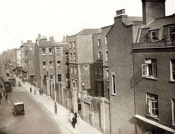 A view of Cleveland Street in the Fitzrovia area of London. The large building right of centre is the Middlesex Hospital out-patients department. It was originally erected in the 1770s as a workhouse for the parish of St Paul Covent Garden
