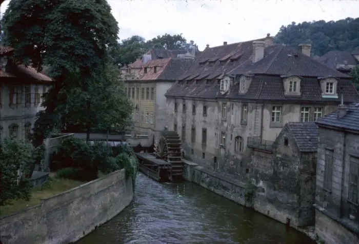 Framed Print : View of a river with buildings and waterwheel Framed Print : View of a river with buildings and waterwheel