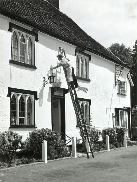 Framed Print : The village decorator, busy painting the front of The Fox Inn, at Finchingfield, Essex, England. Date: 1960s Framed Print : The village decorator, busy painting the front of The Fox Inn, at Finchingfield, Essex, England. Date: 1960s
