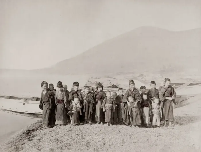Framed Print : Vintage 19th century photograph: group of children on a shore in front of a fishing boat Framed Print : Vintage 19th century photograph: group of children on a shore in front of a fishing boat