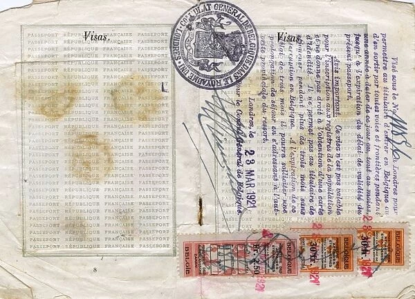 Visa pages with stamps in a French passport