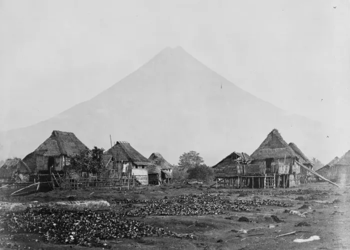 Framed Print : Volcano with straw roofed house in foreground, Moluccas, Ind Framed Print : Volcano with straw roofed house in foreground, Moluccas, Ind