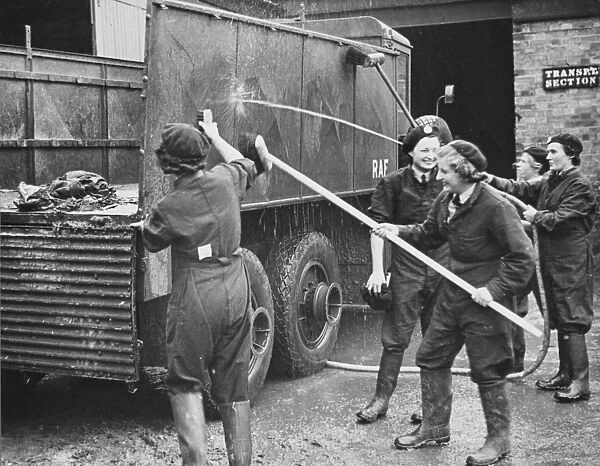 WaF WWII. WaFs washing down an RAF lorry during World War II