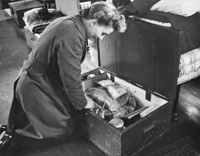 Framed Print : WaF WWII. A WaF inspects her locker at the end of her bed, which holds her tuck Framed Print : WaF WWII. A WaF inspects her locker at the end of her bed, which holds her tuck
