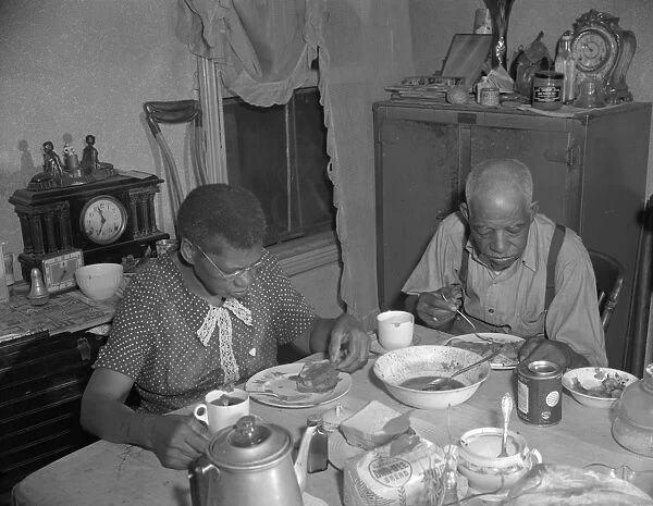 Washington, DC Elderly couple eating dinner at their home on