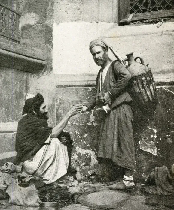 Framed Print : Water carrier handing a drink to seated man, Egypt Framed Print : Water carrier handing a drink to seated man, Egypt