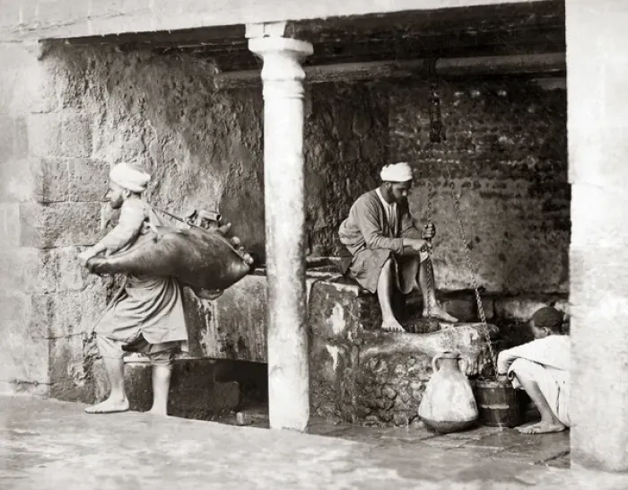 Framed Print : Water carriers filling their bags, Egypt, circa 1880 Framed Print : Water carriers filling their bags, Egypt, circa 1880
