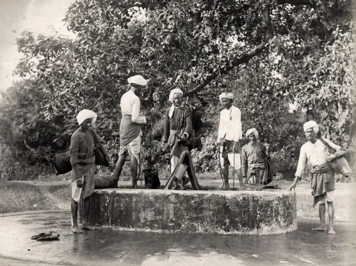 Framed Print : Water carriers filling their skins in a well, India Framed Print : Water carriers filling their skins in a well, India