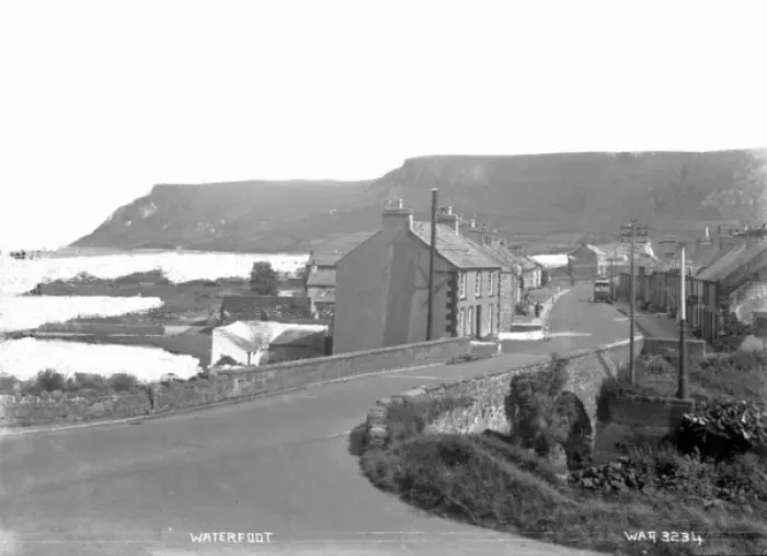 Framed Print : Waterfoot - a view of the town with a stone road bridge in the foreground Framed Print : Waterfoot - a view of the town with a stone road bridge in the foreground