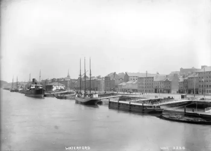 Framed Print : Waterford - an elevated view along the harbour with boats moored and the buildings behind Framed Print : Waterford - an elevated view along the harbour with boats moored and the buildings behind
